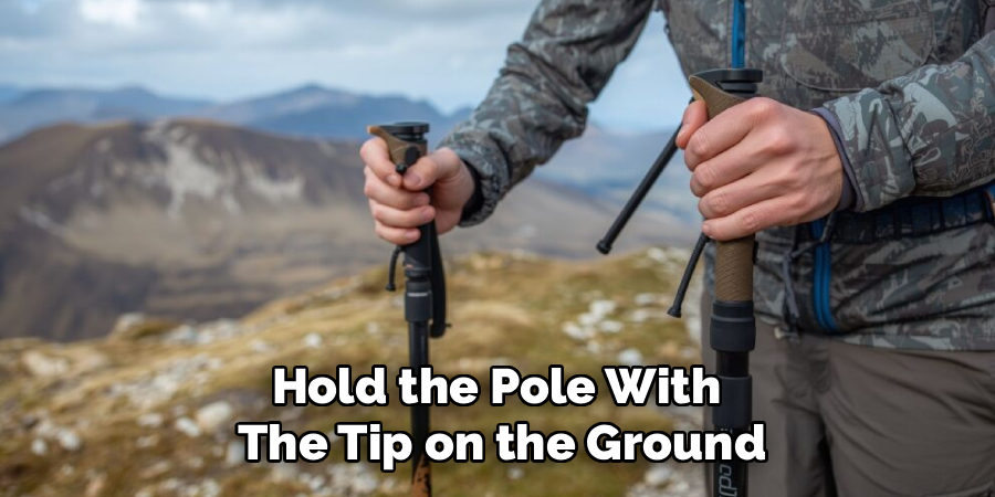 Hold the Pole With
The Tip on the Ground