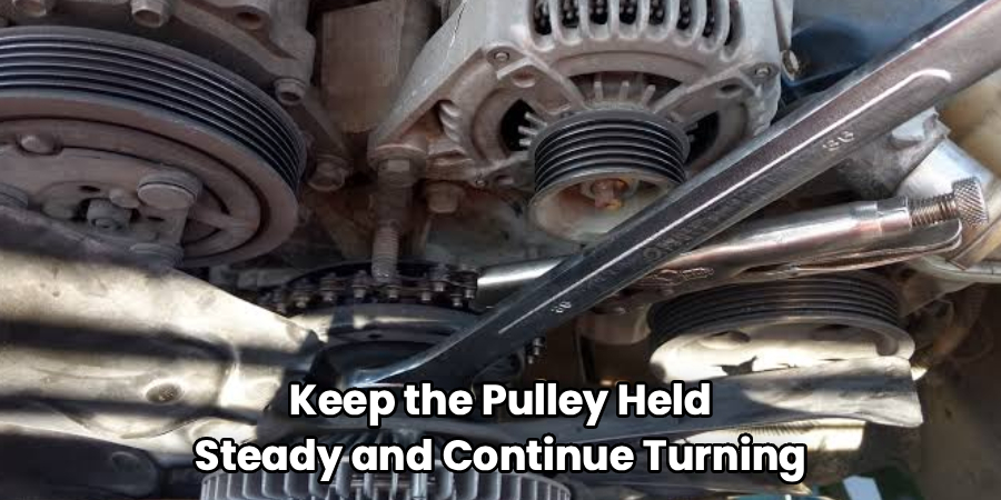 Keep the Pulley Held
Steady and Continue Turning