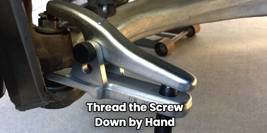 Thread the Screw
Down by Hand