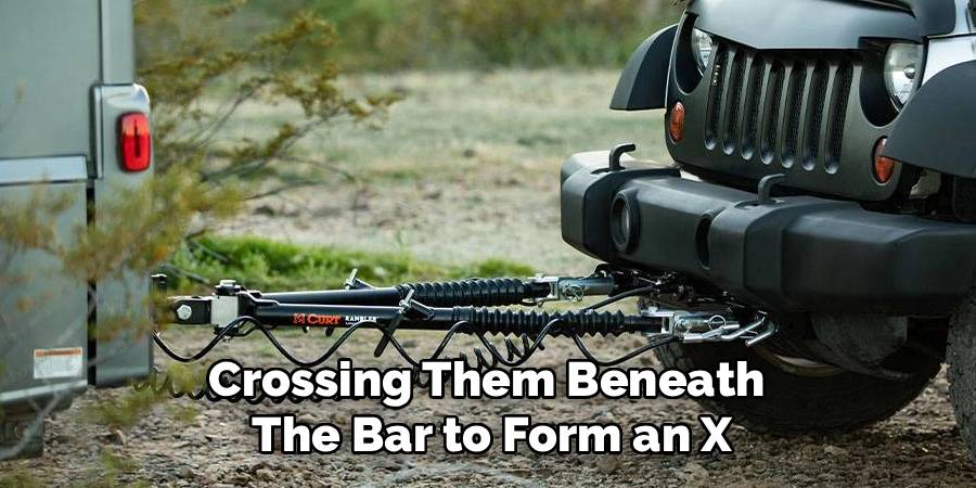 Crossing Them Beneath 
The Bar to Form an X
